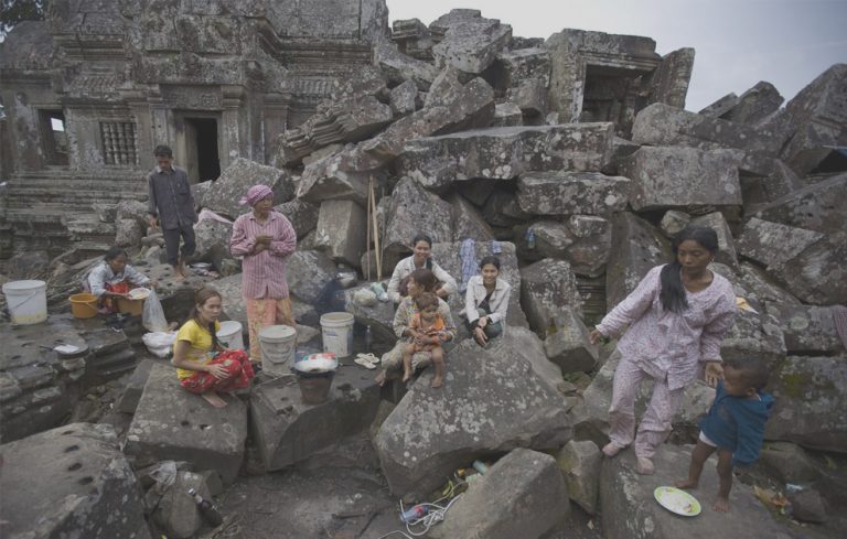RNPS IMAGES OF THE YEAR 2008    Cambodian families reside inside the grounds of the disputed 900-year-old Preah Vihear temple, along the Thai-Cambodian border October 16, 2008. Nearly 200 Cambodian residents living near the temple have taken refuge on its grounds, after recent fighting killed two Cambodian soldiers, a local Cambodian newspaper reported. The International Court of Justice awarded the temple to Cambodia in 1962,  but the court failed to determine the ownership of 1.8 square miles (4.6 sq km) Hindu ruins, a ruling that has rankled with Thais ever since. REUTERS/Adrees Latif (CAMBODIA)